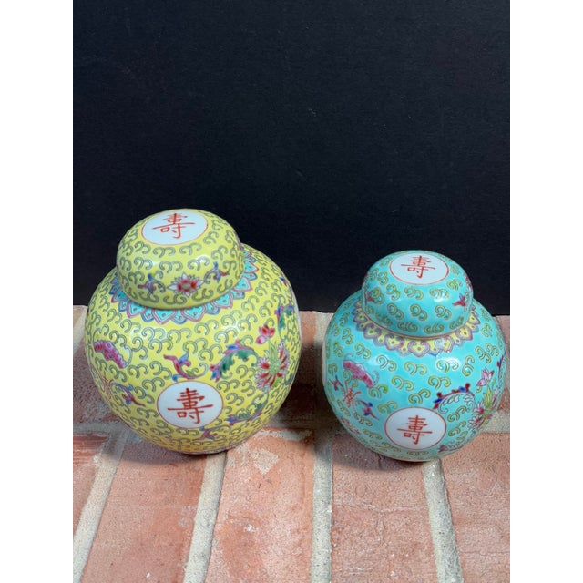 Vintage pair of Chinese Mun Shou porcelain ginger jars from the mid 20th century. Also known as Wan Shou Wu Jiang...