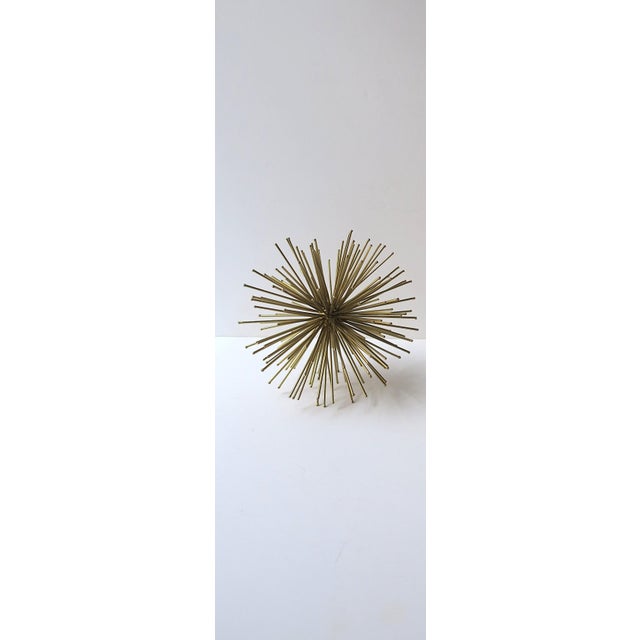 A brass-plate gold-tone sputnik-form sphere decorative object, Midcentury Modern design style, circa late-20th century. A...
