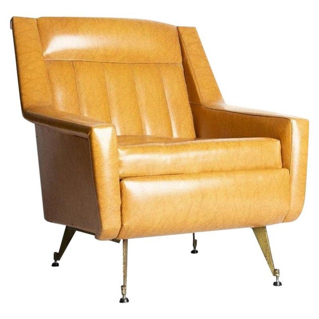 This vintage vinyl armchair is a design furniture produced in Italy in the 1950s. Imitation leather armchair with legs in...