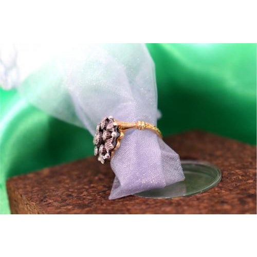 Gold and Silver Ring with Inlaid Zirconias and Flower-Shaped Reliefs, in Very Good conditions. Designed 1980 to 1989 This...