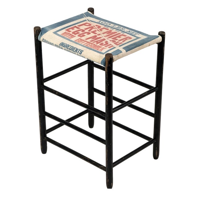 Vintage 1940s tall wooden stool with a black painted frame and a Premier Egg Mash feed sack seat. The frame is built with...