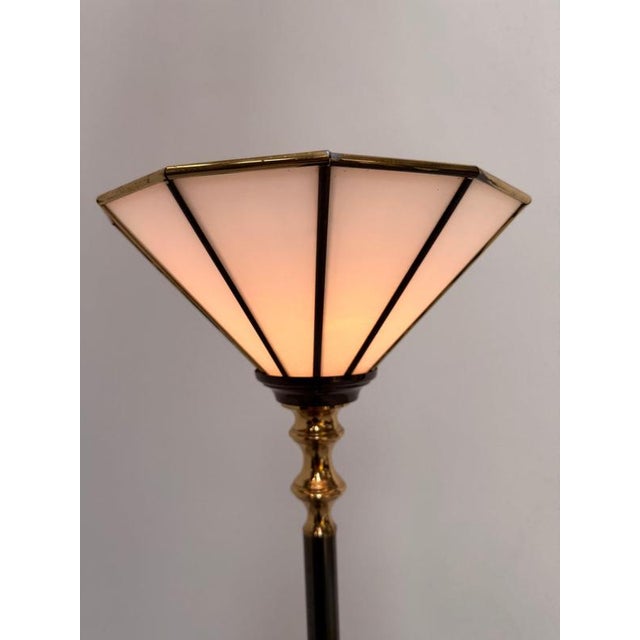 Bring timeless elegance into your interior with this vintage torchiere floor lamp. Featuring a sleek black metal stem,...