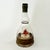 This vintage glass vessel, commonly referred to as a 'Bols Ballerina' bottle, features a dual-chamber glass construction....