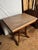 Antique marble top side table in tan Carrera Marble with oak wood base. Possibly 19th century and by the brand Eastlake....