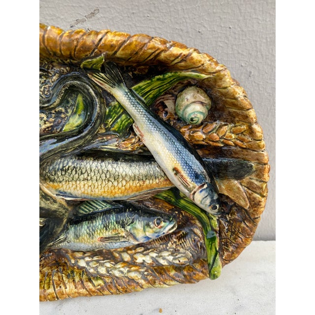 19th Century rare majolica palissy fish basket platter signed Leon Brard. 7 fishs, eel ,ears of wheat ,and shells.