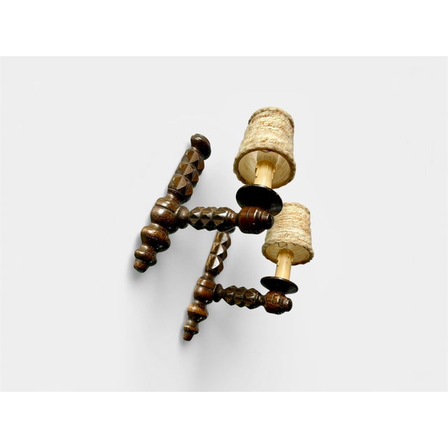 Rare pair of carved oak wall sconces in the style of Charles Dudouyt, France, 1940s. Beautiful hand-carved details, with...