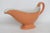 This beautiful footed Gravy Boat is made of Ceramic. This lovely orange colored ceramic piece was made by Shenango China...