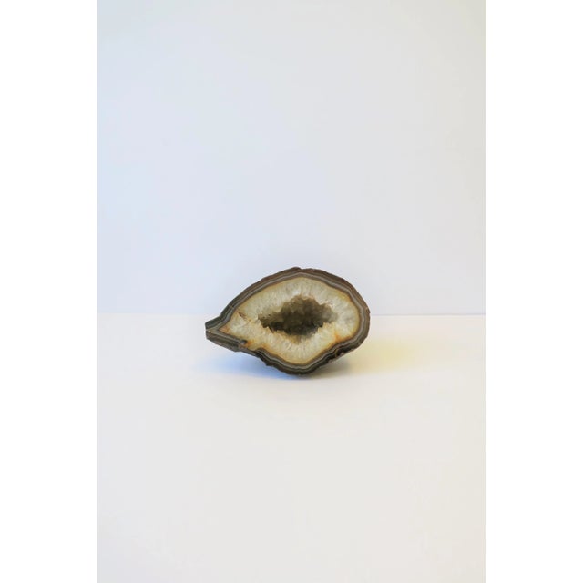 A substantial white and brown agate geode natural specimen sculpture piece. Piece makes a great standalone decorative...