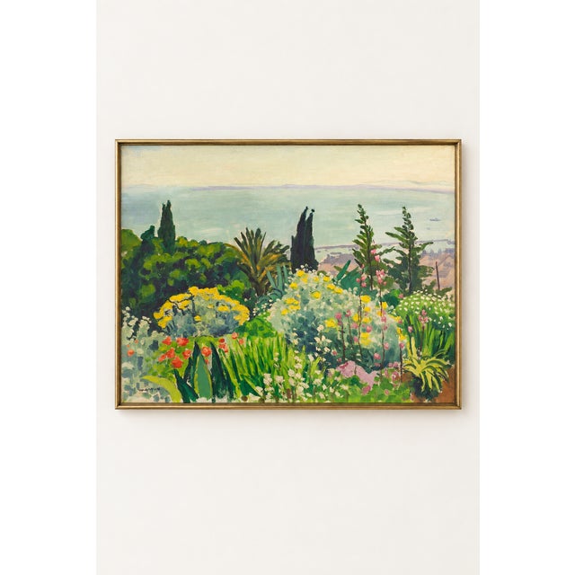 This vintage coastal art print by Albert Marquet captures a lush spring garden overlooking the pale blue waters of Saint-...