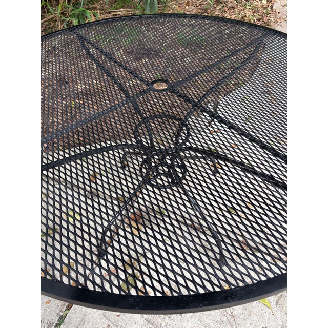 heavy iron salterini iron 48 inch pool side table. recently sandblasted, primed and painted... also sealed, to withstand...
