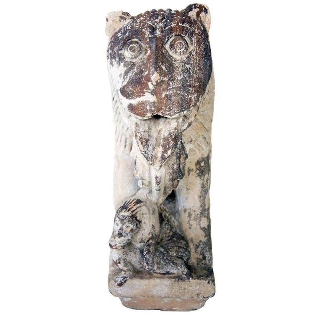 This fierce, but somewhat amusing creature, known as a vyala in northern India, is depicted in the traditional manner with...