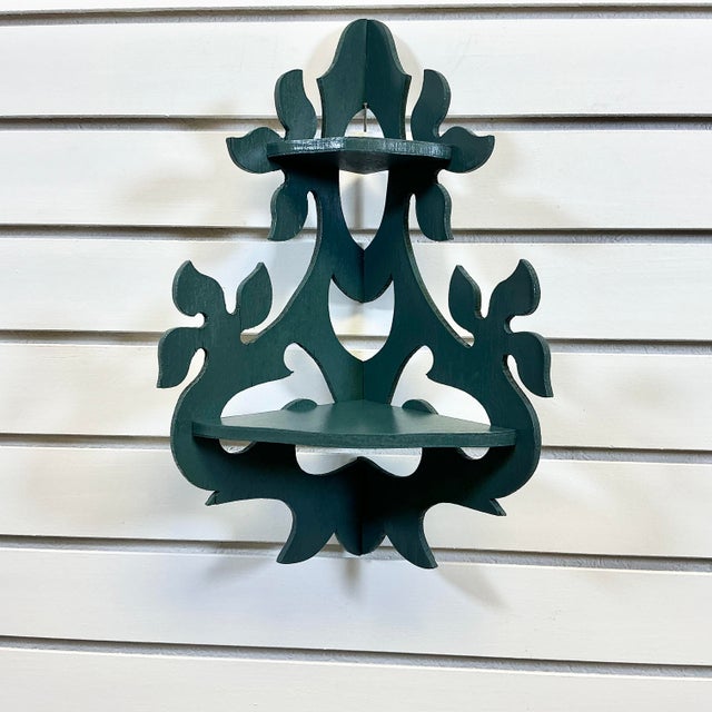 This is just lovely. It’s a two-tier corner wall-mounted Shelf. It’s an Americana Folk Art handmade piece featuring an...