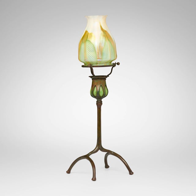 This exceptional Tiffany Studios Pulled Feather Favrile glass blown-out candlestick was created in the United States by...