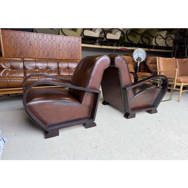 These Jindrich Halabala Armchair chairs were made in Czechoslovakia. Covered in good quality Italian leather, very solid a...