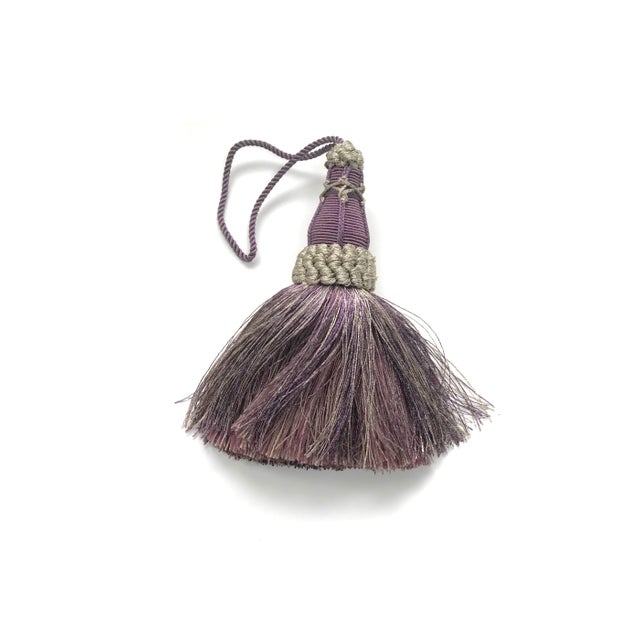 Handmade amethyst and grey colored key tassel with looped ruche, twisted cord and full skirt. Skirt has a blend of colors...