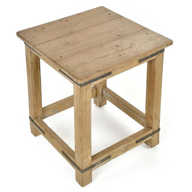 With its simple lines and exposed metal fittings, this square solid wood table seduces with its functional aesthetic and...