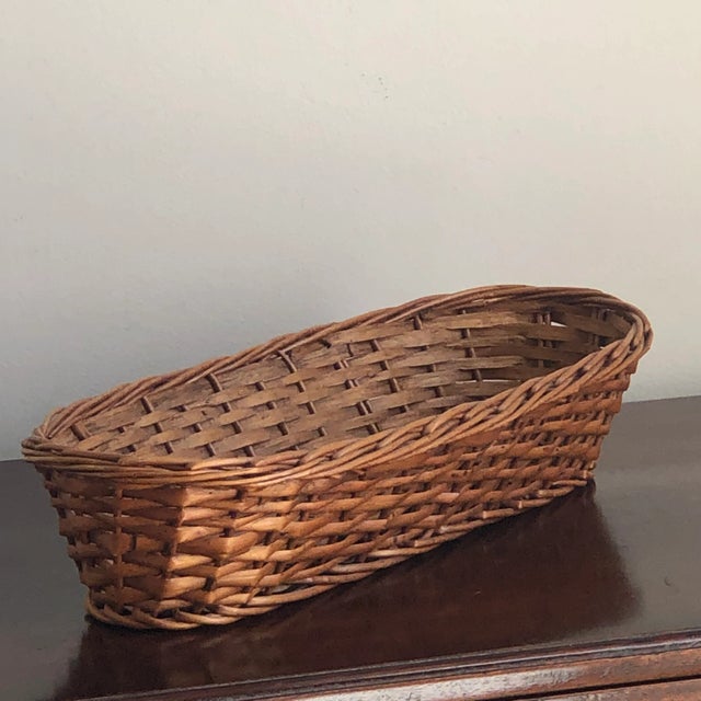 A lovely mid-20th century French bread proofing basket. This basket features French randing and a rich, warm patina that...