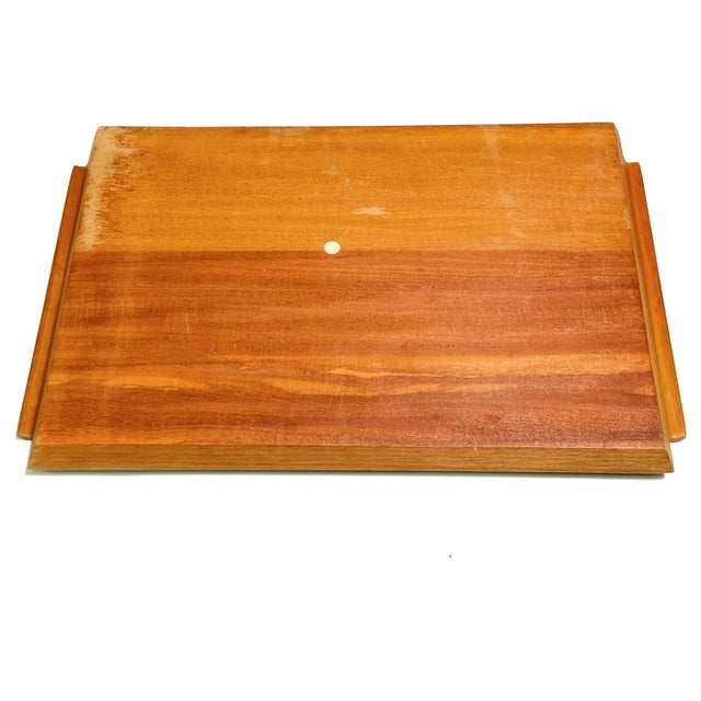 A striking vintage Mid-Century Modern serving tray featuring an eye-catching sunburst marquetry design crafted from...