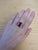 Make a bold statement with this captivating Madagascar Ruby ring. The vivid red center stone is framed by a halo of...
