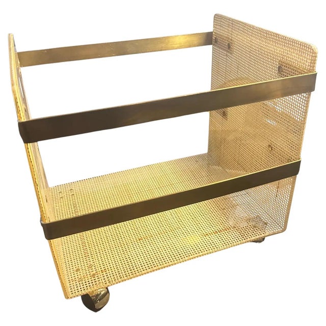 Glamorous 1980s Italian Magazine Stand in Brass and Wicker (Dior Style) A sophisticated and eye-catching piece of Italian...