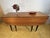 A stunning and iconic mid century modern folding extending dining table by g-plan, dating from the 1950s and originating...