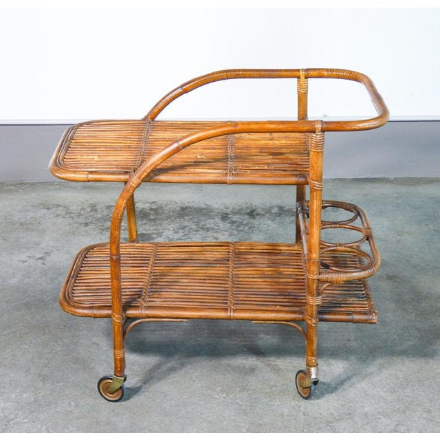 Italian design food trolley from the 70s, in bamboo wood origin italy period 70s designer the line of the trolley is...