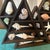 Elevate your coastal or bohemian interior with this striking, hand-crafted wooden curio display shelf. Sculpted into a...
