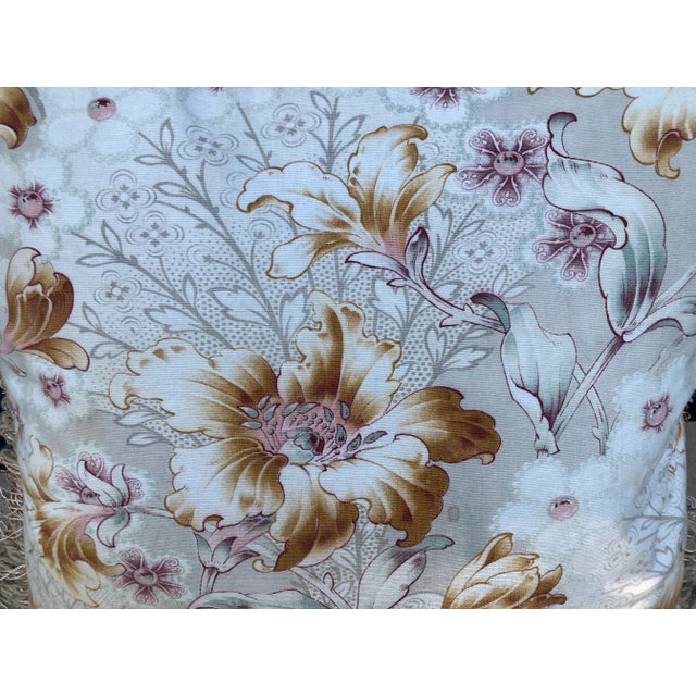 A pillow newly made from a circa 1890’s French printed cotton, backed with coordinating damask and brush fringe. A down...