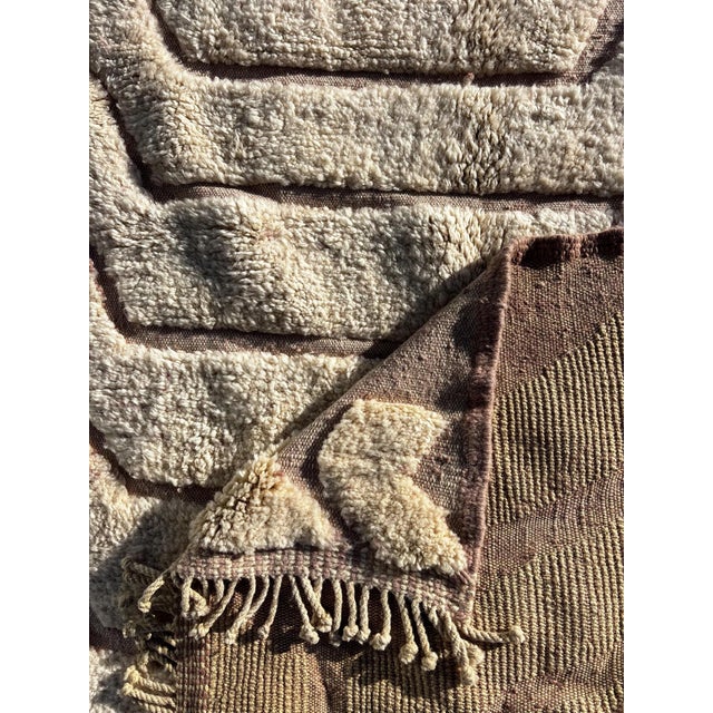 Bring timeless elegance into your home with this Moroccan Mrirt wool rug, handcrafted by skilled Berber artisans from the...