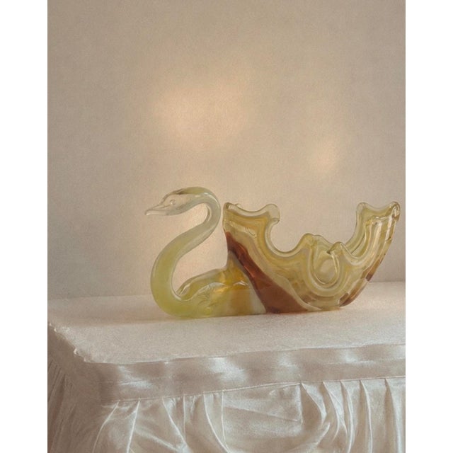 A hand blown art glass swan in vivid chartreuse to olive green with adolescent white marbling through the body. Beautiful,...