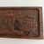 This wooden panel depicts the phrase “the lion shall lie down with the lamb” symbolizing total peace and harmony. It is...