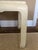 This is a beautiful ivory-colored, mid century table by Baker. It has a textured surface and a Baker label underneath.