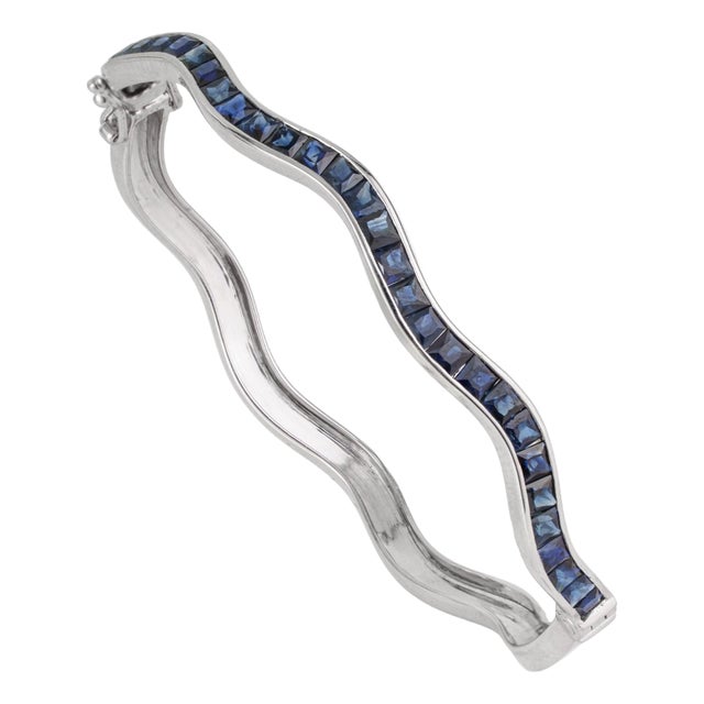 Versatile 4.75 Ct Blue Sapphire Channel Set Hinged Wave Bangle Bracelet by Carat&Her For Sale