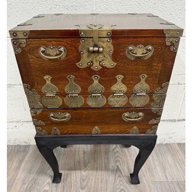 This is a beautiful vintage Korean Bandaji style chest cabinet featuring richly figured elm wood grain and ornate brass...