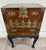 This is a beautiful vintage Korean Bandaji style chest cabinet featuring richly figured elm wood grain and ornate brass...
