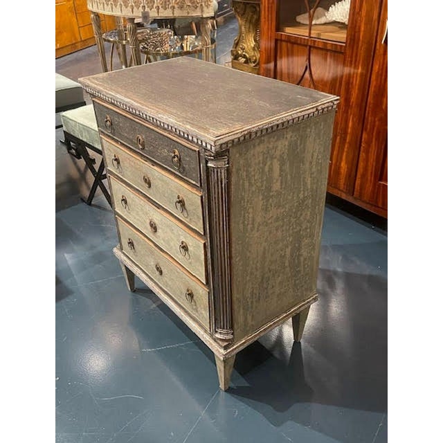 The 19th c. Swedish Gustavian Painted Chest is a historical piece of furniture with a classic design. This chest was...