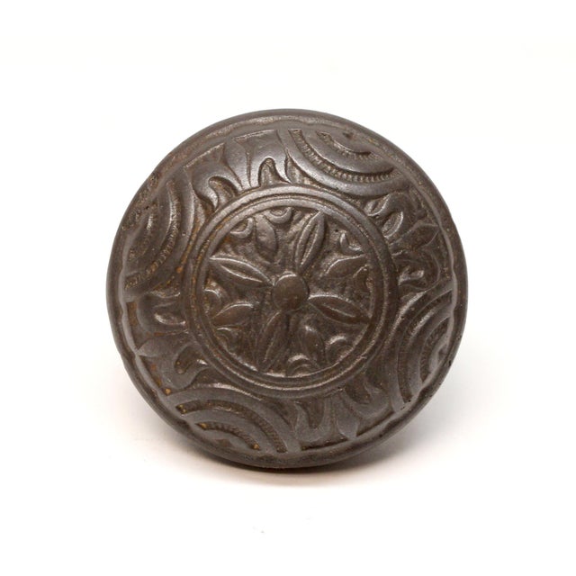 This Vernacular style four fold door knob was made by Mallory Wheeler in the 1885 catalog. It is part of the H-24400...