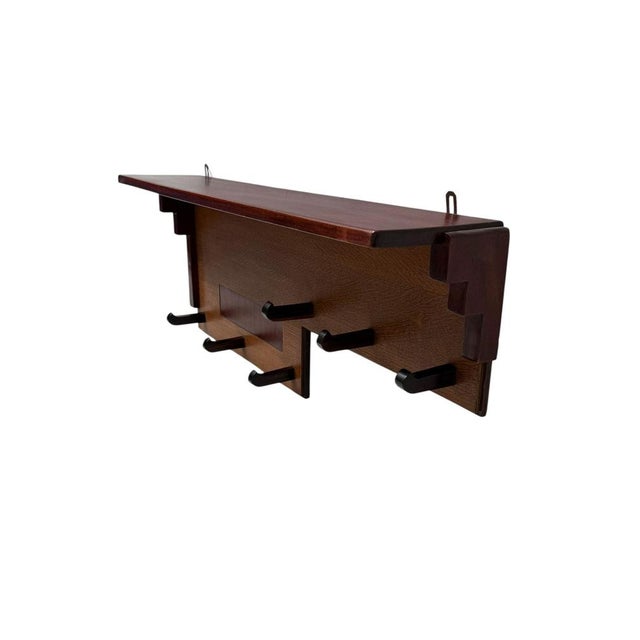 Magnificent and rare Art Deco Amsterdamse School wall coat rack. Striking Dutch design from the 1920s. Solid oak with...