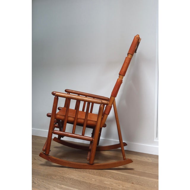 A handsome vintage rocking chair handcrafted in Costa Rica in the classic campaign or "safari" tradition. The chair pairs...