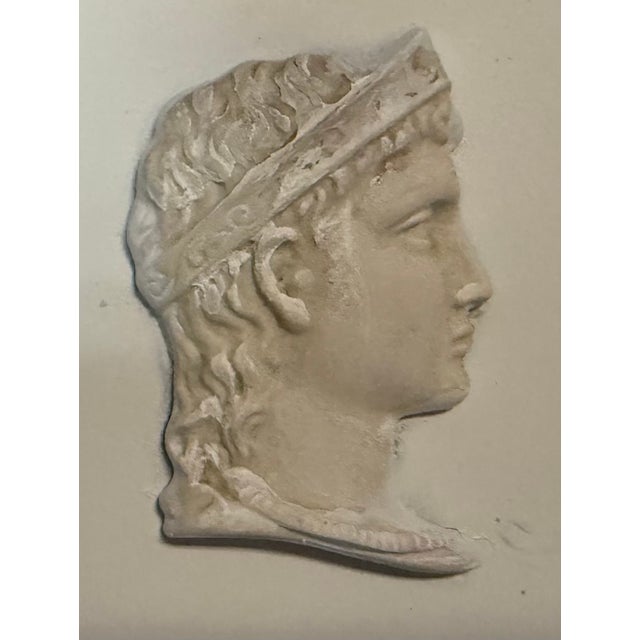 This is a mid-century Italian neoclassical framed plaster Greco-Roman busts. It is a set of four, and each bust is...