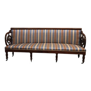 Upholstered Curved Charles X Mahogany Sofa on Casters, 19th Century For Sale