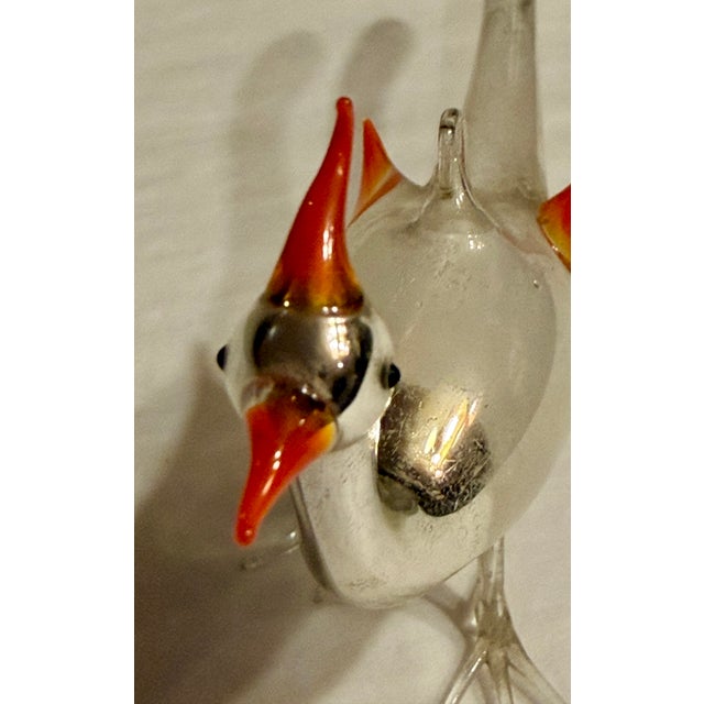 Wonderful antique mercury glass bird ornament with orange plumage and beak. Hand blown white body with silver head and...