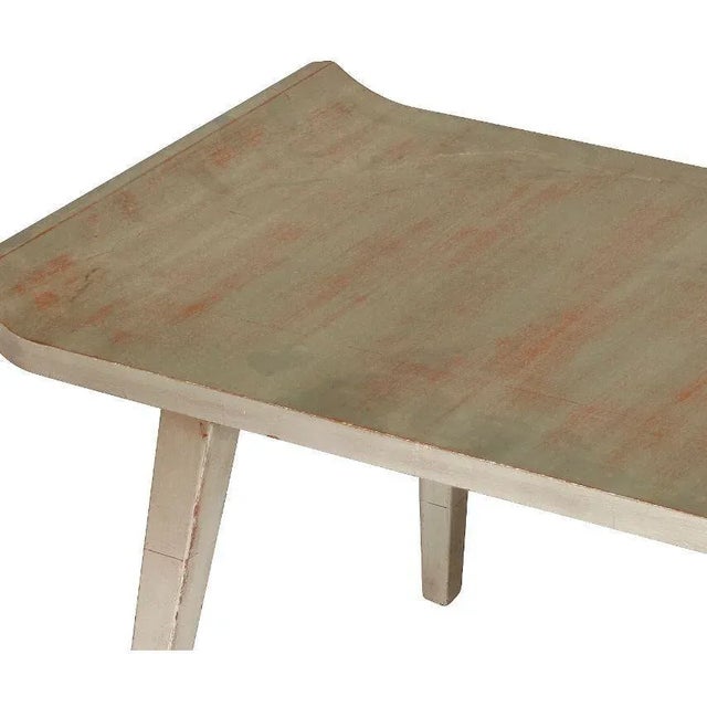 Pair of silver leaf painted low tables in Asian style.