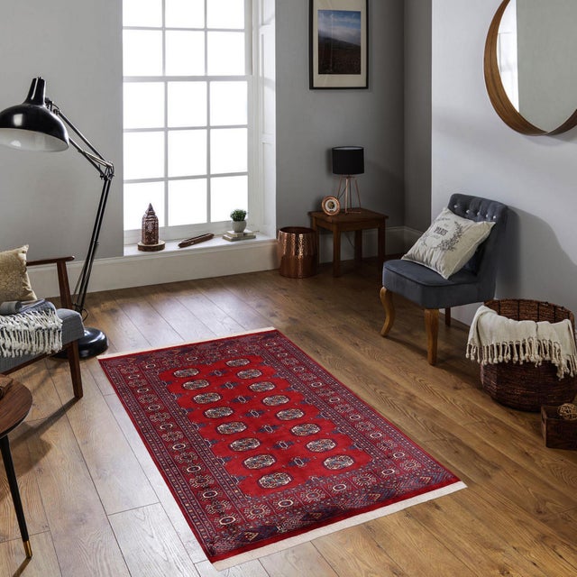 Transform the interior of your home with a beautiful hand-knotted Bokhara rug. Meticulously crafted with intricate...