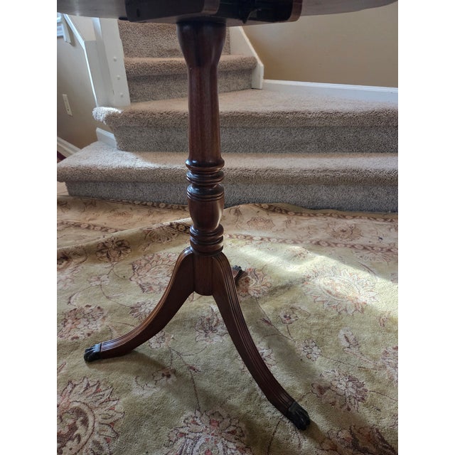 Brown Pie Crust Tilt Top Table With Turned Tripod Base Brass Claw Feet For Sale - Image 8 of 13