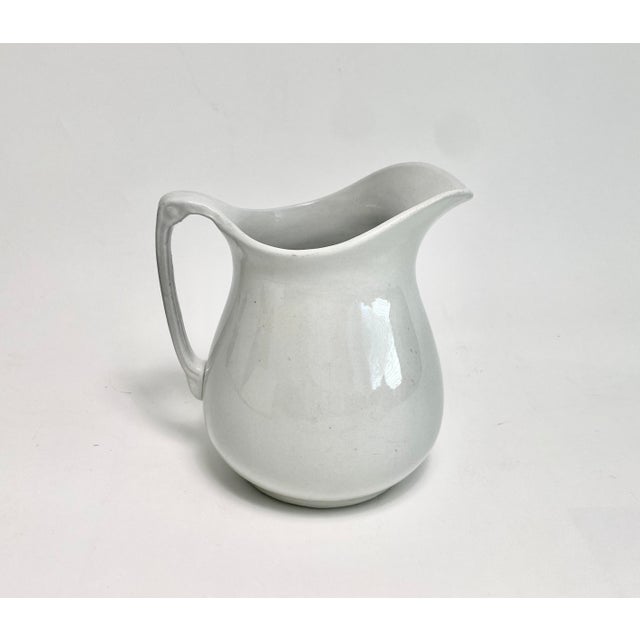Turn of the century English ironstone pitcher by Wood & Sons in the traditional white earthenware that is so collectible...