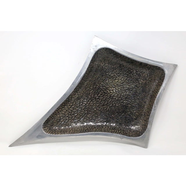 A vintage, cast aluminum centerpiece bowl, with a 24-inch long, atomic star form, low profile, and textured black/green...