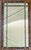 We are selling this 20th century decorative Chinoiserie style mirror. This mirror has black and gold painted faux bamboo...