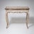Small Baroque-style table with a folding top, curved legs and apron. When unfolded, the tabletop measures 88 x 88 cm and...