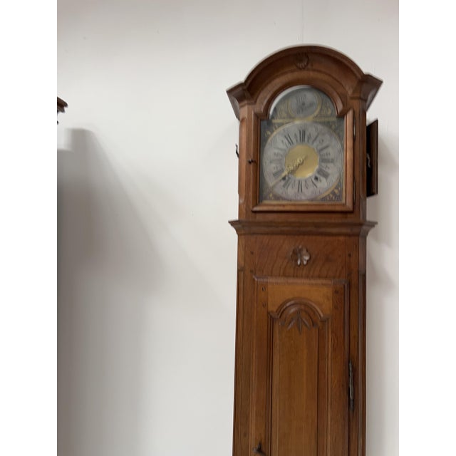 Louis xv style grandfather clock with a gendarme's hat top finely carved solid oak single-bell movement with a pewter face...